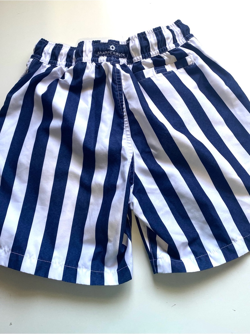 The Snapper Rock Navy and White Wide Stripe Swim Trunks.